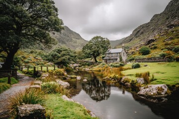 Naklejka premium Picturesque mountain valley with a small stone cottage reflecting in a calm stream