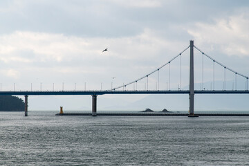 suspension bridge on the cloudy sea