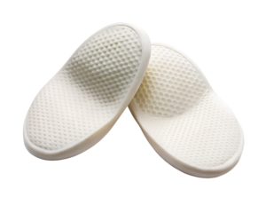 Pair of white orthopedic insoles for foot comfort and support, isolated on transparent background