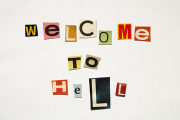 Welcome to hell written with cut out letters from magazines