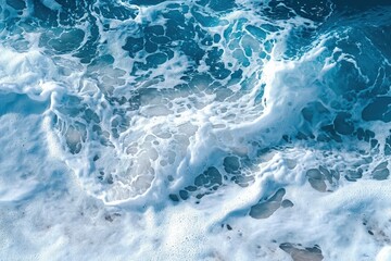 Obraz premium Ocean Waves A Top Down View of Foamy Ocean Waves Crashing on the Shoreline with White Bubbles