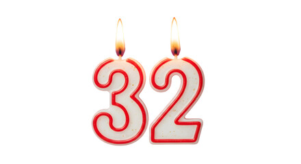 Two lit candles shaped as the number thirty two against a black background for a birthday cake