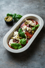 salad with tomatoes, mozzarella and basil