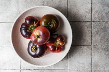 black prince tomatoes on a dark background