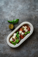 salad with tomatoes, mozzarella and basil