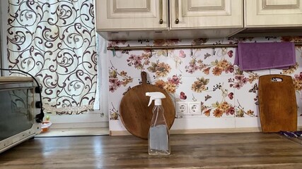 Teenage girl engaged in household chores in the kitchen, tidying up and fulfilling domestic responsibilities. Focused and diligent, she helps maintain a clean and organized home environment. 