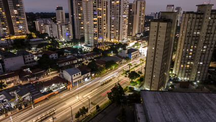 view from above of vehicle traffic and the bus lane of an avenue in the south zone of the city of Sao Paulo in the late afternoon