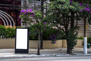 white blank advertising billboard. street mockup panel. digital lightbox poster ad banner board. bus shelter advertising. vertical format sign in Brazil