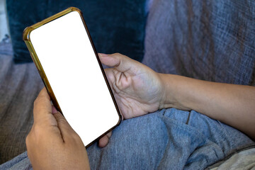 Mockup image of woman's hand holding white mobile phone with blank screen in Brazil