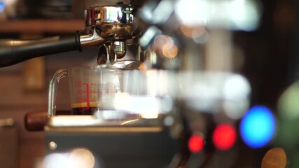 Close-up of espresso coffee pouring from portafilter into a cup, professional coffee brewing - Powered by Adobe