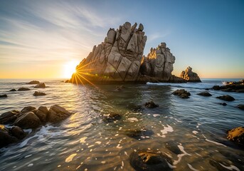 Sunrise at Sea: Rocky Outcrops and Golden Light on the Water