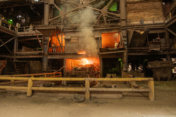 Ferroalloy shop. Liquid metal leaking out