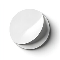 A minimalist composition featuring two overlapping white discs with subtle shadows on a white background