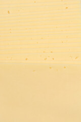 A close-up shot shows the texture of stacked cheese slices, creating horizontal stripes