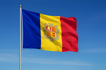 The Andorran flag waves under a clear blue sky.
