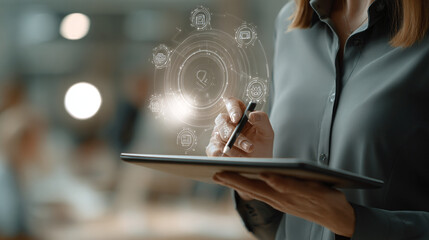 Businesswoman interacts with digital interface on tablet, showcasing innovative technology solutions