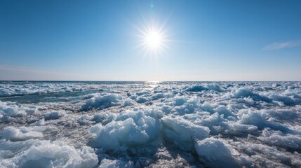 Fototapeta premium Scattered ice floats under bright sunlight in a frozen landscape on a winter day