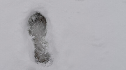 A Lonely Path in Fresh Snow: Close-up of Footprints