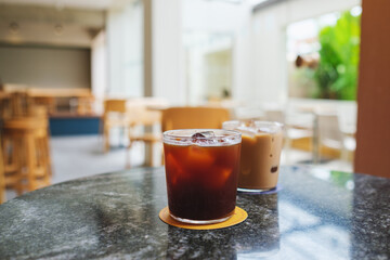 Two glasses of iced coffee on the table in cafe