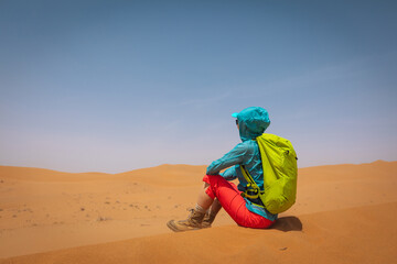 Backpacking woman hiking  in the desert
