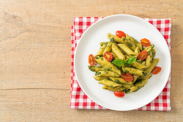 penne pasta with pesto sauce and tomatoes