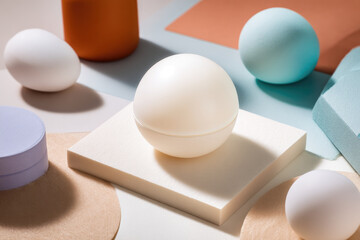 Fototapeta premium Minimalist round container soft pastel background geometric shapes modern cosmetic packaging clean design creative branding gentle light calm mood product display