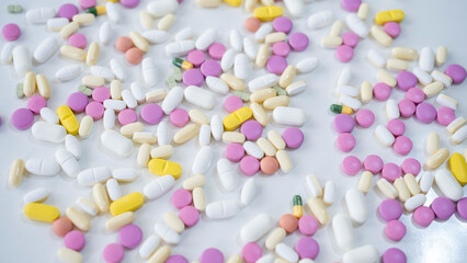 Pills, tablets, capsules, vitamins and omega3 on the white table