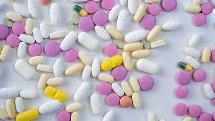 Pills, tablets, capsules, vitamins and omega3 on the white table