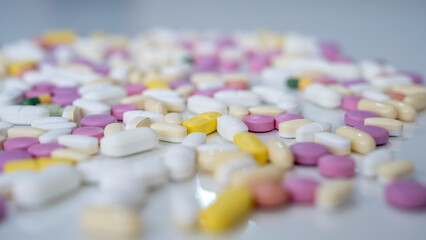 Pills, tablets, capsules, vitamins and omega3 on the white table