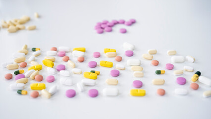 Pills, tablets, capsules, vitamins and omega3 on the white table