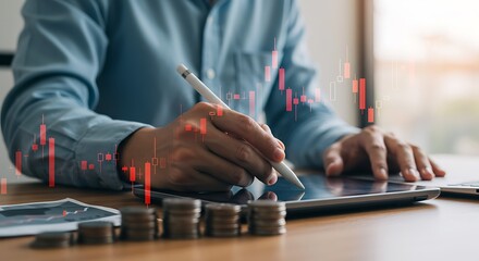 Businessman analyzing stock market data on digital tablet with stylus, financial investment, coin stacks, and red candlestick chart overlay