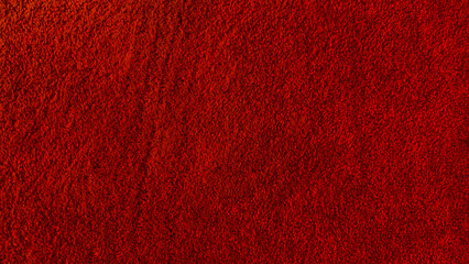 High resolution red carpet texture. close up detail of wool or nylon flooring fibers for seamless background or interior design mock up.
