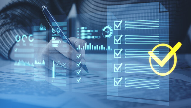 Hand filling out checklist with digital data graphics overlay, symbolizing analysis, productivity and task completion concept in modern technology environment.
