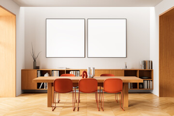 Modern dining room interior with wooden furniture and two blank framed posters on clean white wall for mockup or art template concept layout display. 3D Rendering