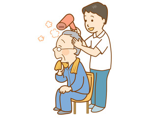 高齢者の入浴後、髪を乾かす介護士