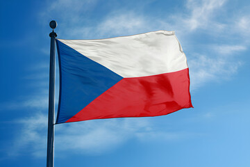 The Czech Republic flag waving under a bright blue sky.