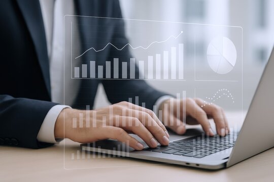 Professional using laptop for financial analysis with data analytics and growth charts, modern workplace