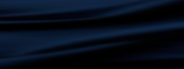 Fototapeta premium A close-up of rippled, dark blue fabric. The fabric has soft folds and shadows, creating a sense of depth and texture.