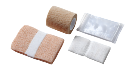 A still life of medical supplies including bandages gauze and antiseptic wipes on a black background