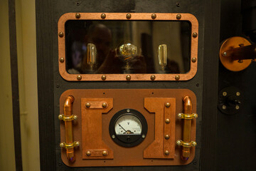 steampunk machine with buttons, tubes and lamps