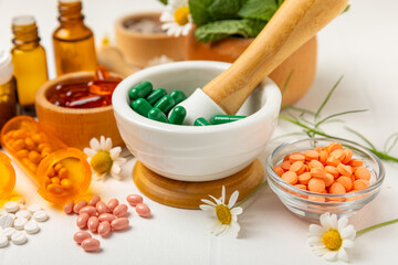 Alternative medicine herbal capsule organic drug on wooden background.Assortment of herbal and tablets,vitamins and dietary supplements.medicinal and Healing herbs.natural supplements for healthy life