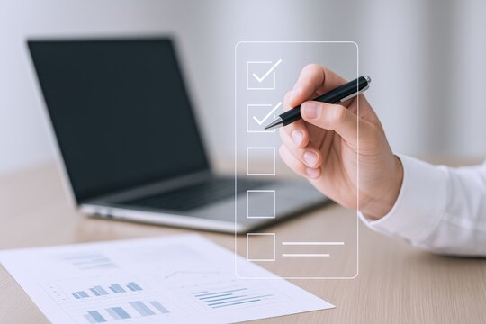 Completing Digital Checklist on Transparent Interface with Pen and Laptop, Modern Office Setting, Business Concept