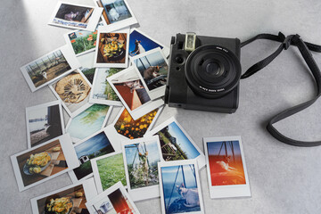 Capturing memories through an analog camera surrounded by colorful snapshots of life