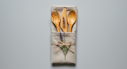 Eco-Friendly Wooden Cutlery Set on Linen Napkin with Lavender Decor: Sustainable Table Setting