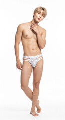 Fototapeta premium Asian male model wearing lace thong & stockings for men. Seductive and daring, perfect for intimate occasions, cosplay, or bold fashion statements.