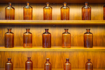 empty perfume glass bottles on shelves