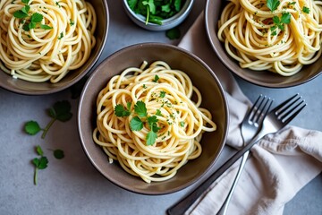 Three bowls of spaghetti with parsley garnish pasta herbs