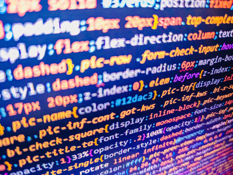 PHP syntax highlighted. Screen of web developing php code on dark background. Software development. Web software. Focus point on the decrypted word