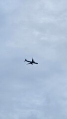 The airplane is flying over residential buildings.