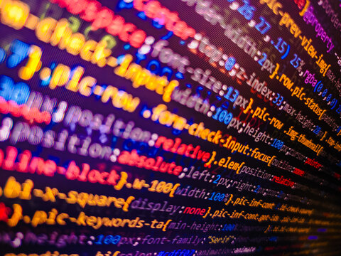 Websit. Web development code: CSSSASS styles preprocessor script lines. Closeup of Java Script and HTML code. Software abstract background. Creative focus effect. Digital technology modern background
